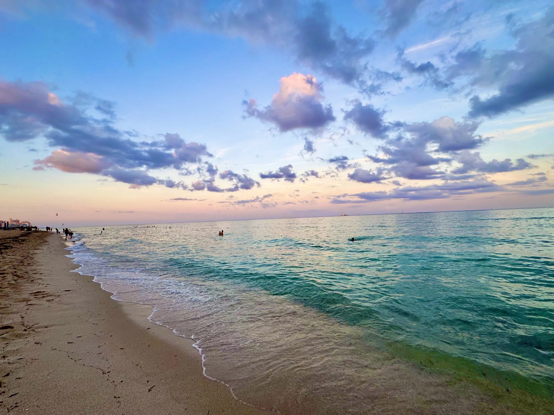 Soft sunset over a calm sandy shoreline